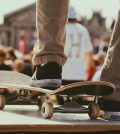 picture of a person standing on a skateboard in front a crowd
