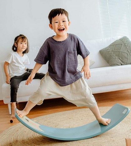 happy kid on balance board