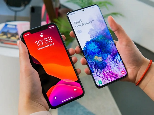 Holding iphone 11 pro max and samsung galaxy s20 ultra  in hands