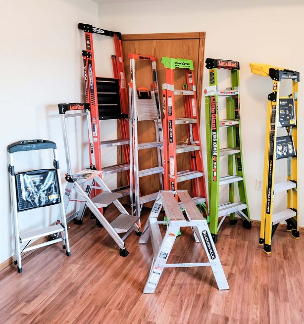 Close-up of 8 different types of step ladders