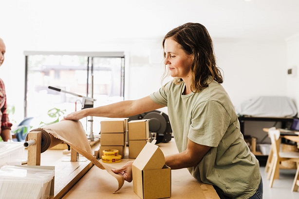 woman making packages for a product