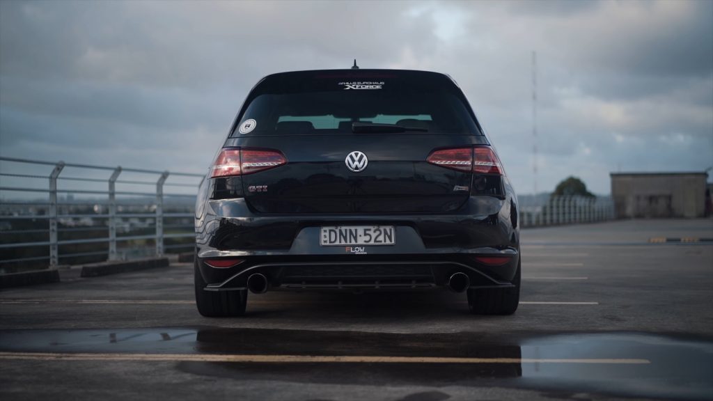 Rear view of a Volkswagen Golf GTI with aftermarket dual exhaust system